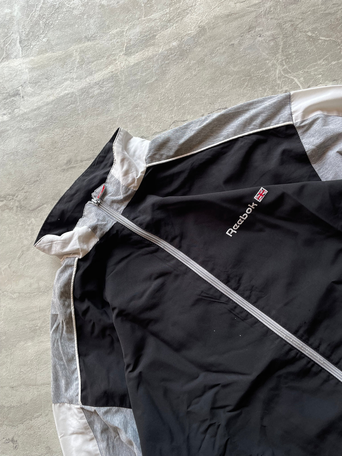 BLACK,GREY AND WHITE REEBOK TRACK JACKET-XL-2XL