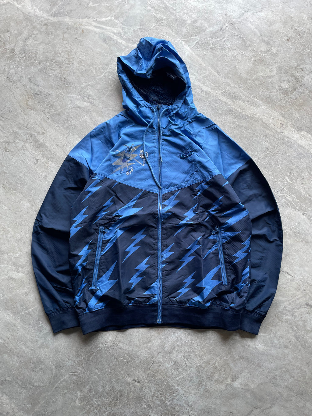 VINTAGE NIKE BLUE X TODD JAMES “THE RUNNING MAN “WINDBREAKER-